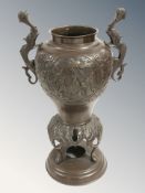 A 20th century Chinese bronze twin handled vessel, height 28 cm.