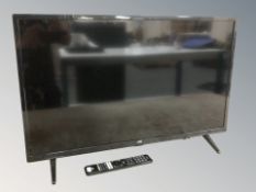 A JVC 32 inch LCD TV with lead and remote