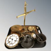 A set of oak and brass scales, clock movement, pewter chamber stick, cast iron mortar and pestle.
