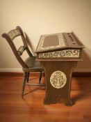 A painted pine child's writing desk and matching chair.