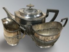 An EPNS three piece tea service, tea pot 14 cm high.