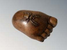 A Japanese Meiji period carved hardwood okimono in the form of a spider atop a foot, length 7 cm.