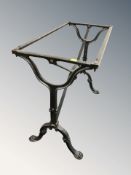 A cast and painted metal table base, length 81 cm.
