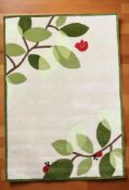 Brand new children's ladybirds in trees design 100% wool rug, 180 cm x 120 cm.