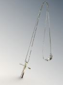 Two 18ct gold pendants forming a crucifix, one set with diamonds, on an 18ct white gold chain.