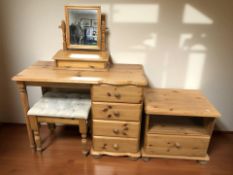 A modern pine four drawer single pedestal dressing table, 101 cm x 48 cm x 74 cm,