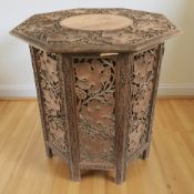 A 19th century Anglo-Indian heavily carved octagonal occasional table,
