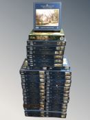 Approximately thirty eight Thomas Kinkade jigsaw puzzles.