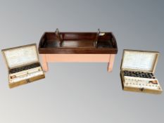A mahogany book slide, a twin handled stand with painted base,