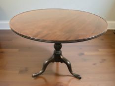 A George III mahogany snap top tripod occasional table, 93 cm diameter x 73 cm H.