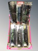 A group of six die cast scale model locomotives on plinths.