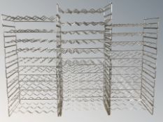 A quantity of stackable bottle rack shelves,