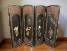 A Japanese lacquered elm inlaid and gilt Shibayama four fold screen, each panel 49 cm x 154 cm.