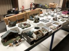 A very large quantity of Thomas Kinkade ornaments including many Christmas theme model houses,