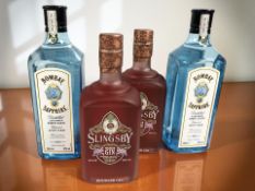 Two bottles of Bombay Sapphire London dry gin, 700 ml, and a two bottles of Slingsby rhubarb gin,