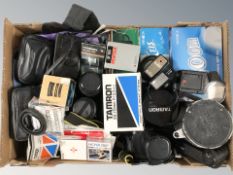 A quantity of photography equipment including a Pentax ME Super camera, various lenses, flashes,