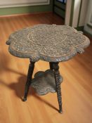 An Anglo-Indian heavily carved hardwood tripod occasional table, height 53 cm.
