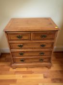 A reproduction yew wood five drawer chest, 63 cm x 41 cm x 72 cm.