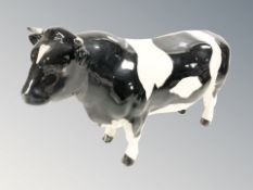 A Beswick bull, CH Coddington Hilt Bar, length 21 cm.