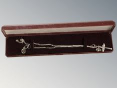 A silver Celtic pendant on chain, and a further crucifix pendant on chain.