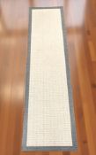 A flatweave runner,