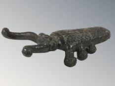 A cast iron beetle bootjack, length 27 cm.