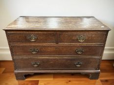 A George III oak four drawer chest on bracket feet, width 110 cm.