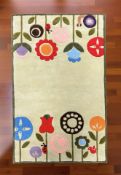 Brand new children's floral design 100% wool rug, 150 cm x 90 cm.