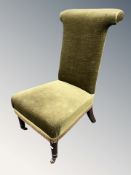 A Prie Dieu chair, in green dralon upholstery, height 90 cm.