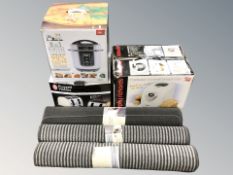 Three boxed kitchen appliances and three new rugs