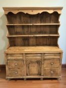 A late Victorian pine farmhouse dresser, 151 cm x 53 cm x 196 cm.