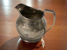 A silver milk jug, Birmingham marks, height 9 cm. CONDITION REPORT: 117g.