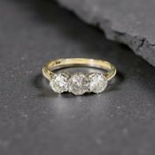 An 18ct gold three stone diamond ring, approx 0.5ct, size O CONDITION REPORT: 2.