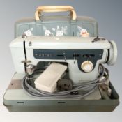 A Jones electric sewing machine with lead and pedal