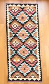 A Chobi kilim runner, 198 cm x 65 cm.