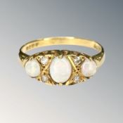 An 18ct gold opal and diamond ring, size L CONDITION REPORT: 2.