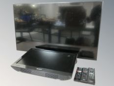 A Sony Bravia 42 inch LCD TV with lead and a further Sony monitor with remotes