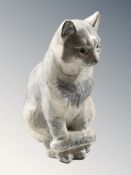 A Welsh pottery figure of a seated cat with glass eyes, height 26.5 cm.