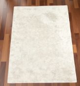 A contemporary shaggy pile rug,