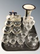 A set of six gilt rimmed champagne glasses, two further sets of glasses,