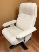 A stained bentwood swivel reclining lounge armchair in oatmeal fabric, width 77 cm.