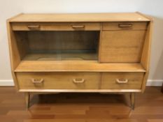 A 20th century oak cocktail sideboard, 122 cm x 48 cm x 95 cm.