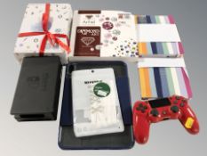 A Playstation controller, bead making kit, diamond art kit, two notebooks, iPad case,