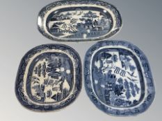 Three blue and white transfer printed meat plates, largest 50 cm diameter.