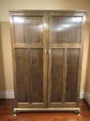 An early 20th century mahogany The Verithing gent's compactum wardrobe with fitted interior,
