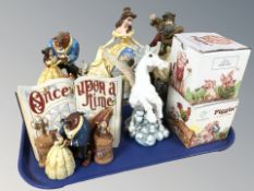 A group of Walt Disney showcase collection figurines and boxed Piggin ornaments.