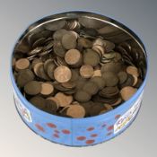 A tin containing assorted British pennies.