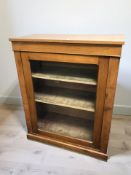 A Victorian walnut glazed single door side cabinet, 87 cm x 43 cm x 107 cm.