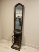 A reproduction mahogany mirror backed hall stand, with umbrella stand beneath,