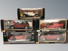 Five Bburago die cast scale model cars in boxes.